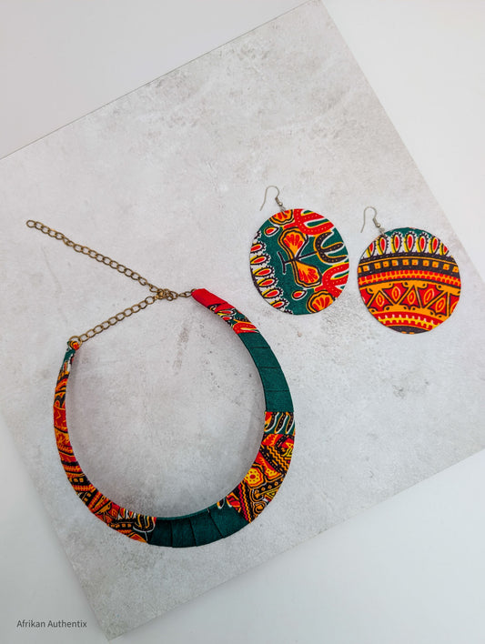 African Ankara fabric jewelry set with patterned necklace and round earrings on white background
