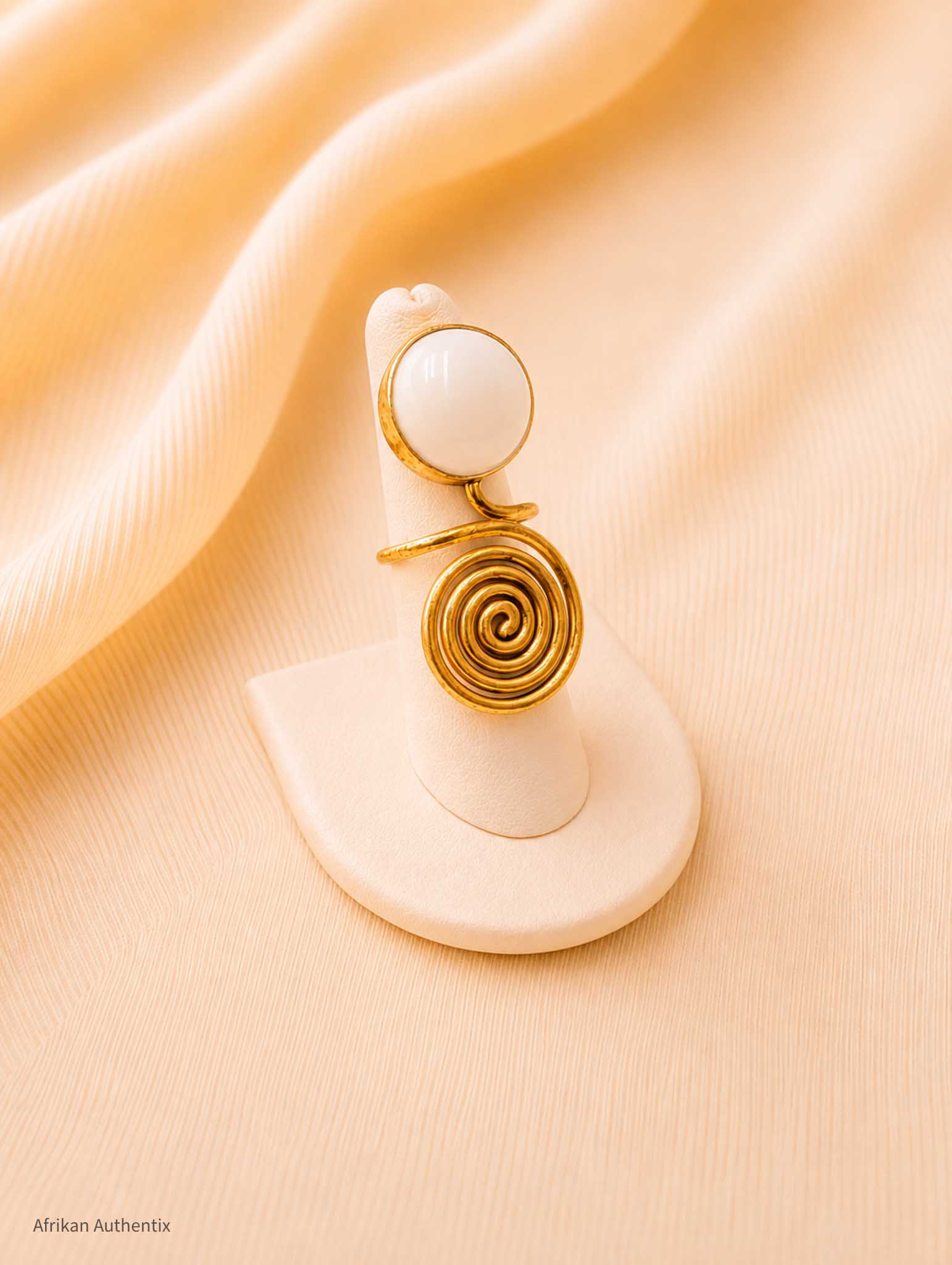 Brass and white spiral ring
