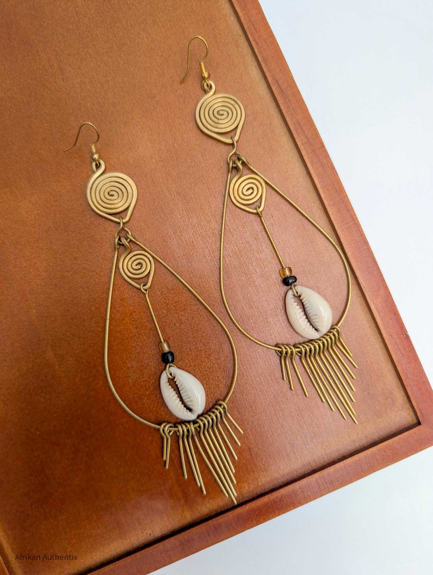 Brass cowrie shell earrings