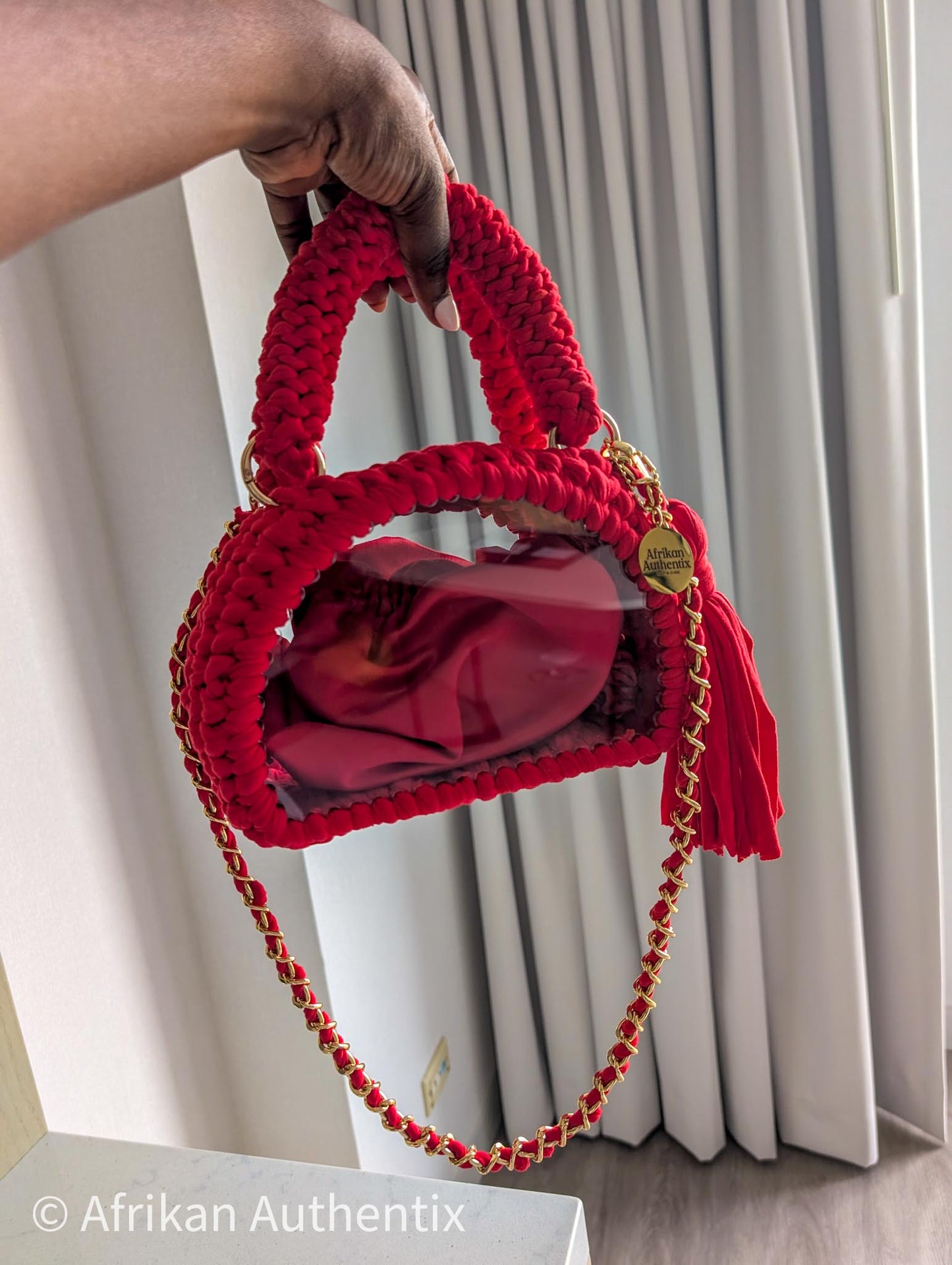 Red crochet mini handbag with gold chain strap and clear window by Afrikan Authentix
