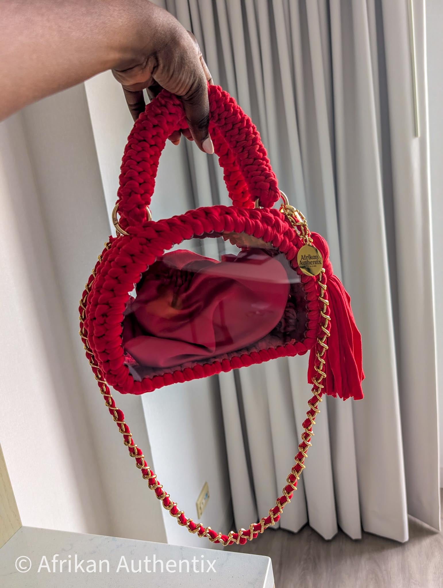 Red crochet mini handbag with gold chain strap and clear window by Afrikan Authentix
