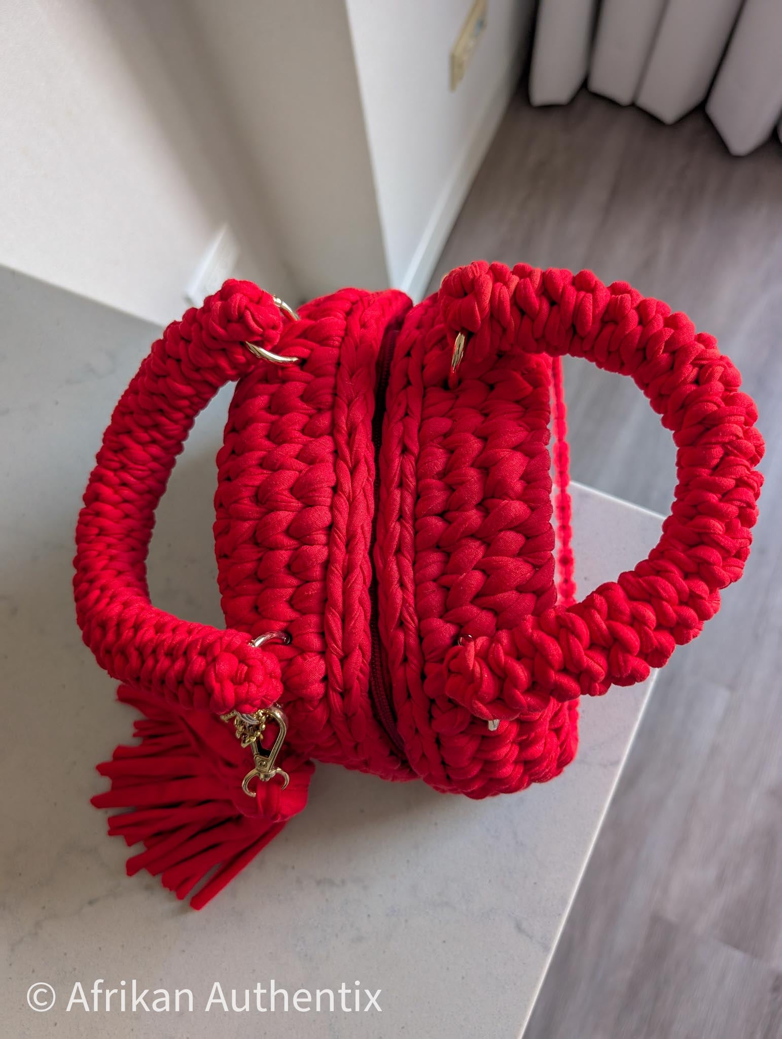Red crochet mini handbag with gold chain strap and clear window by Afrikan Authentix
