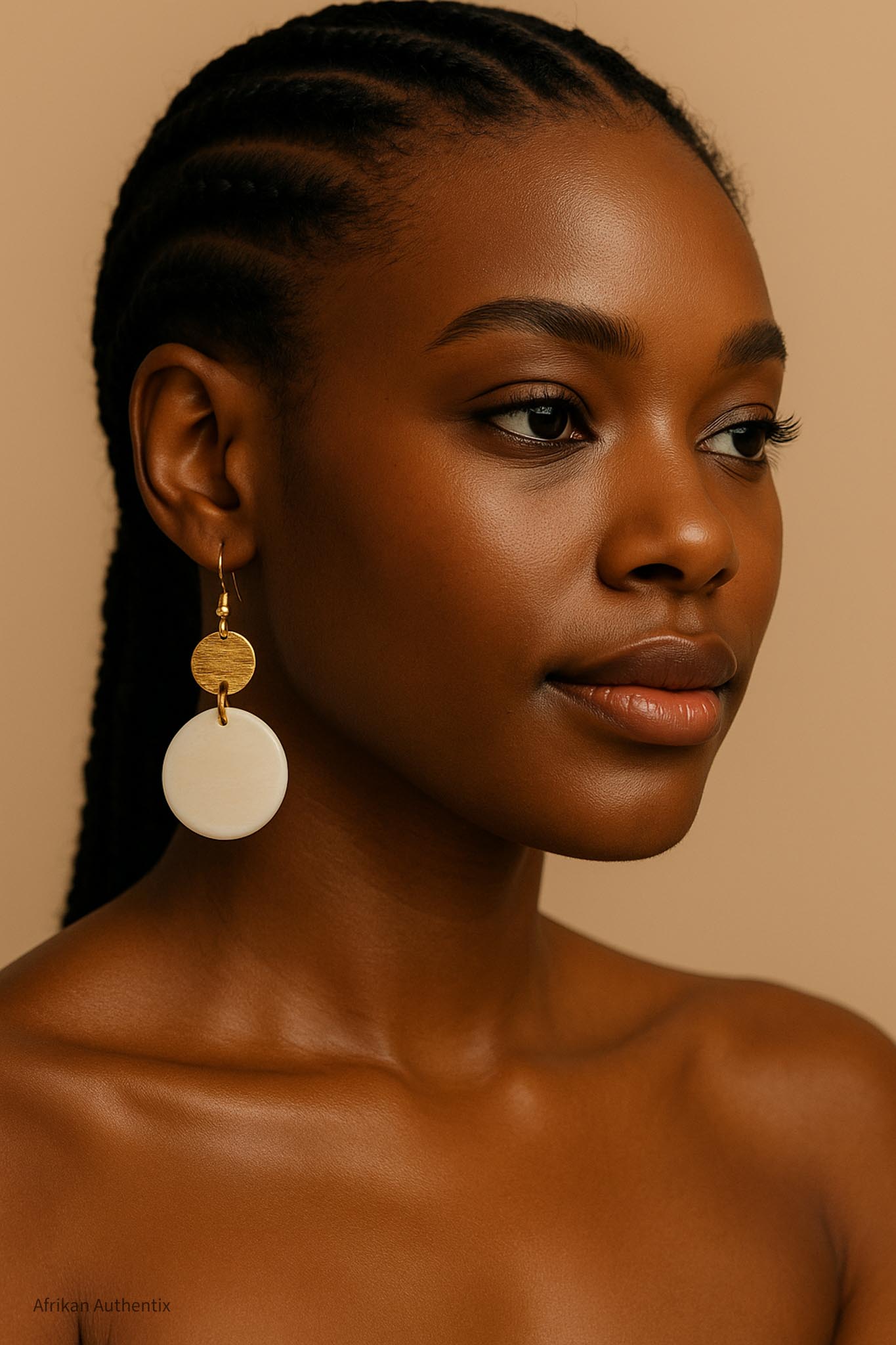Model wearing handmade bone and brass African disc earrings from Afrikan Authentix