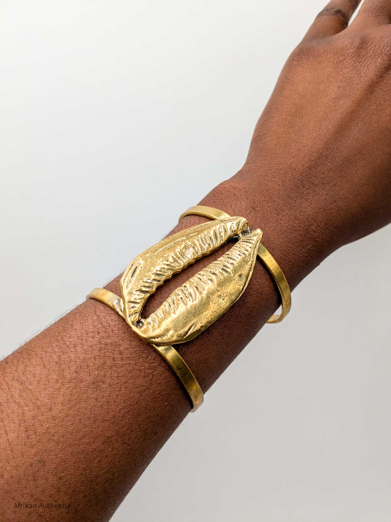 Chunky cowrie shell cuff bracelet