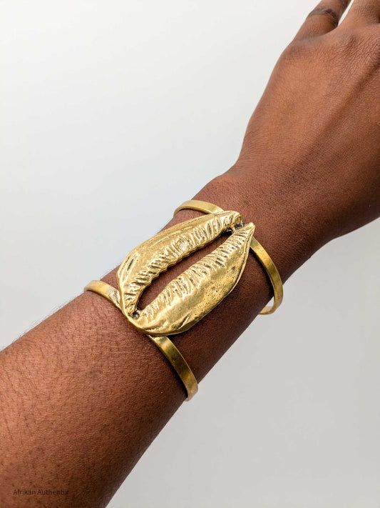 Chunky cowrie shell cuff bracelet