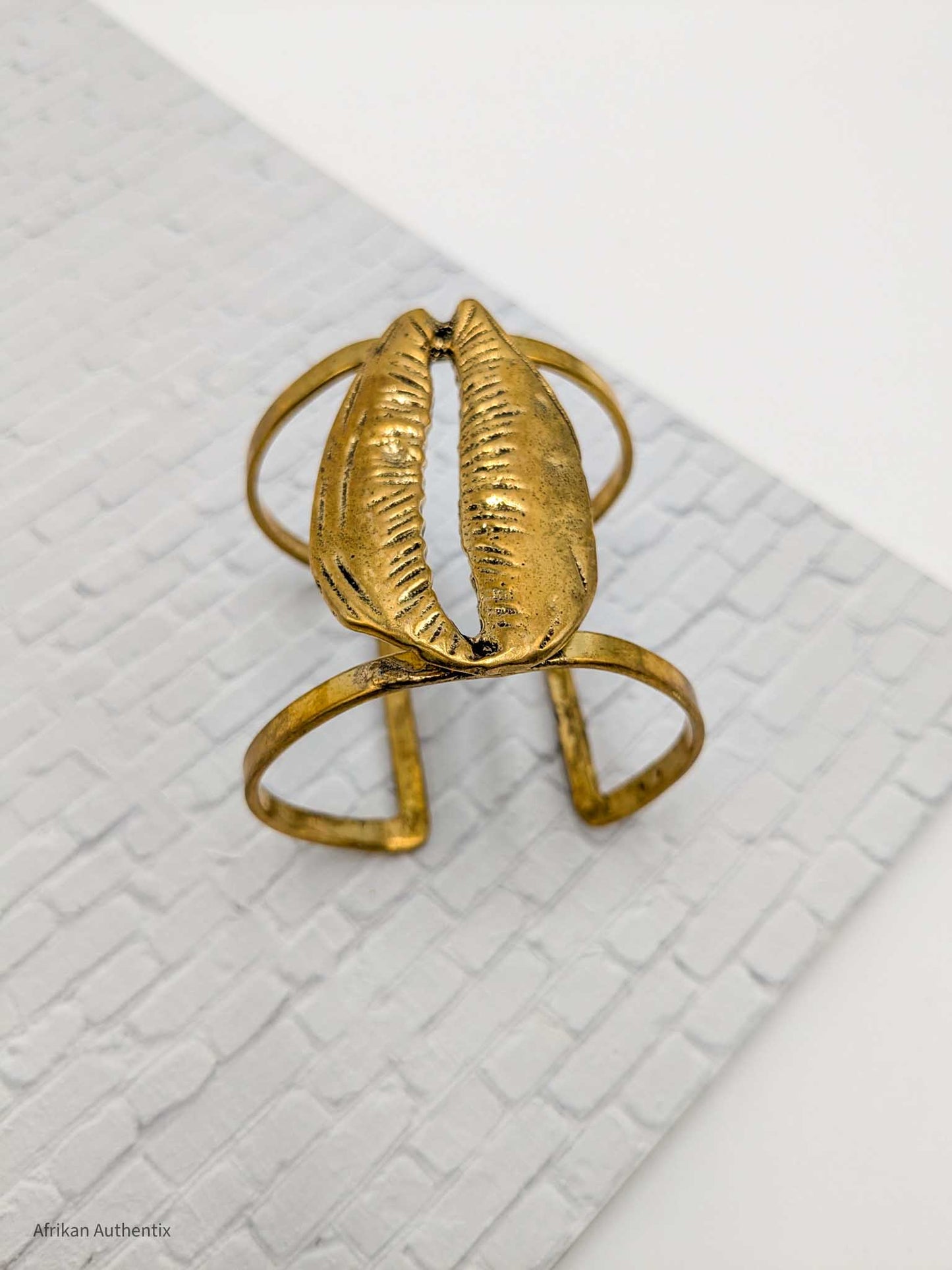Chunky cowrie shell cuff bracelet