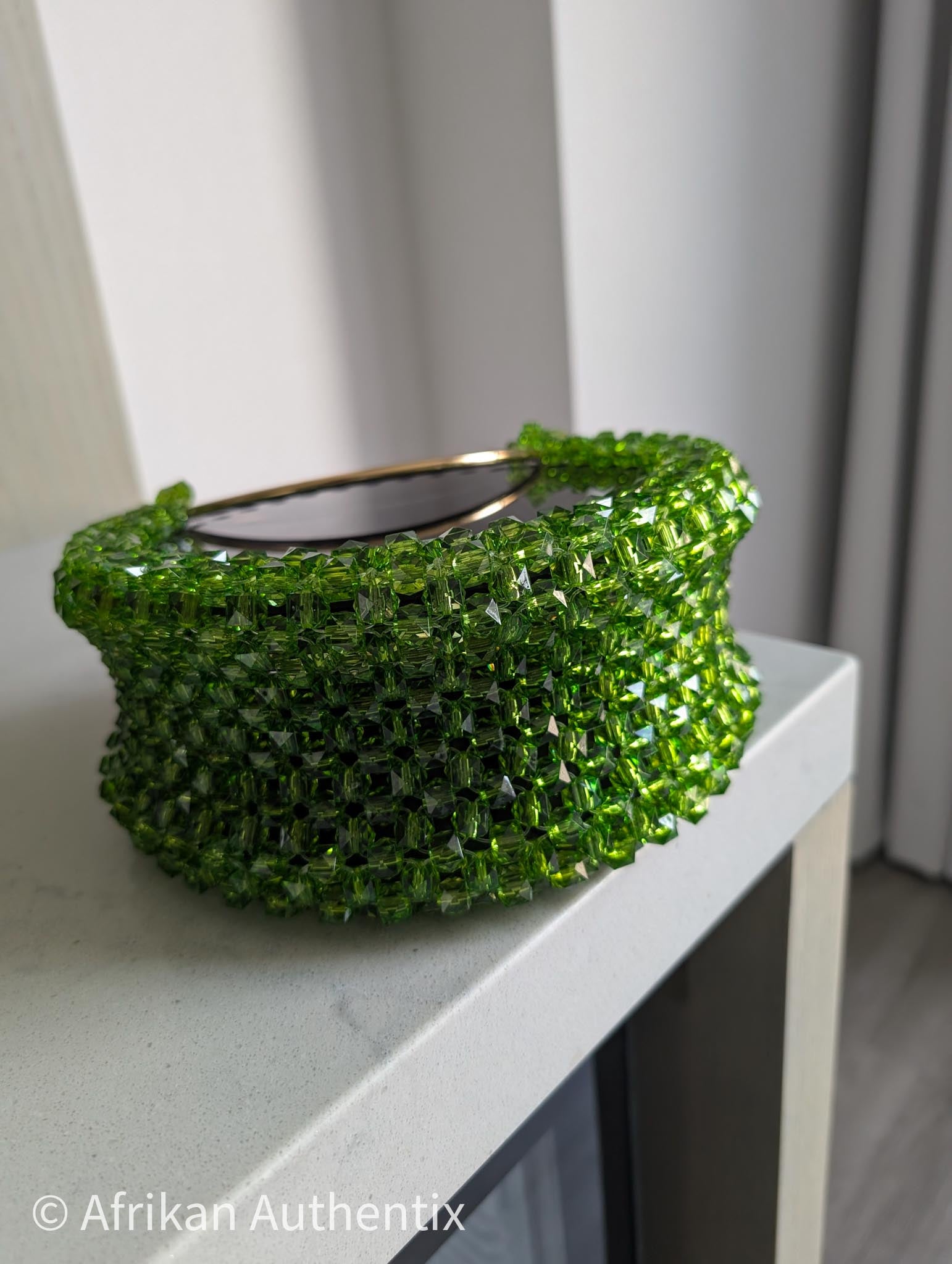 Green beaded round handbag with gold ring handle handmade in Ghana by Afrikan Authentix