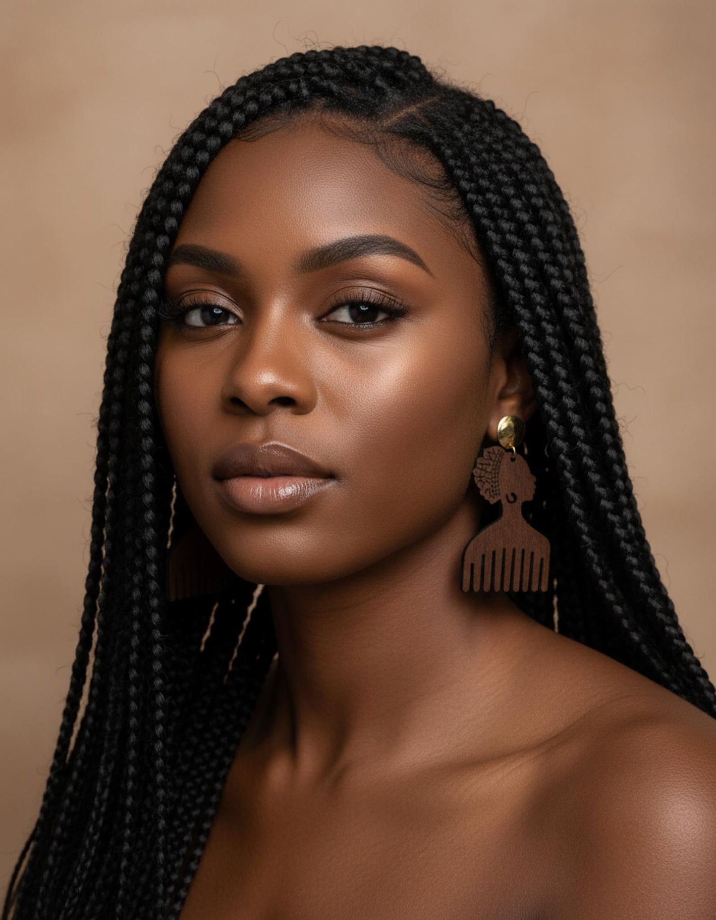 Woman with braided hair wearing brown afro comb wooden earrings