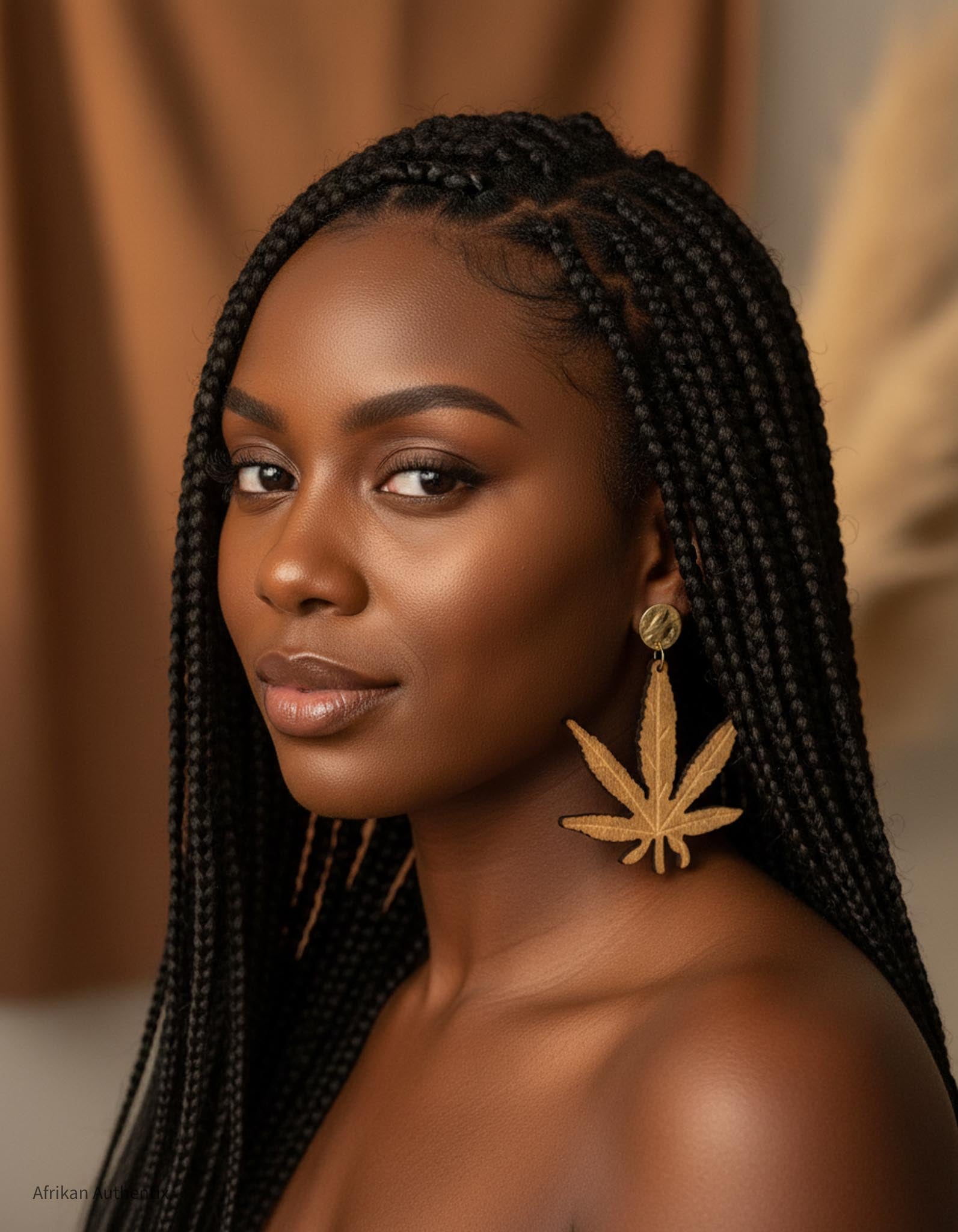 Woman with braided hair wearing Hemp leaf wooden earrings