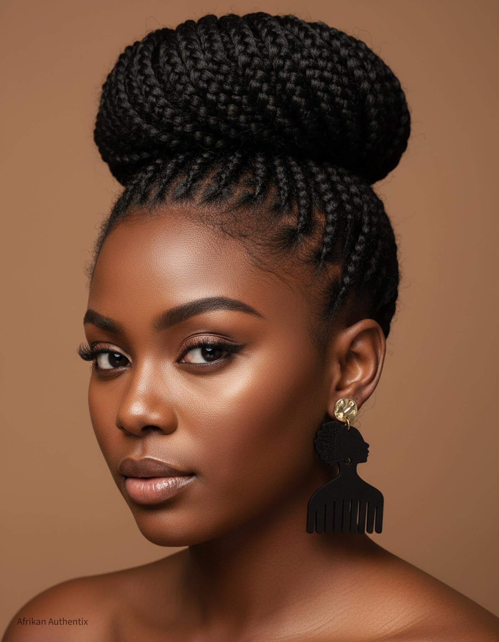 Woman with braided hair styled in an updo wearing black afro comb wooden earrings
