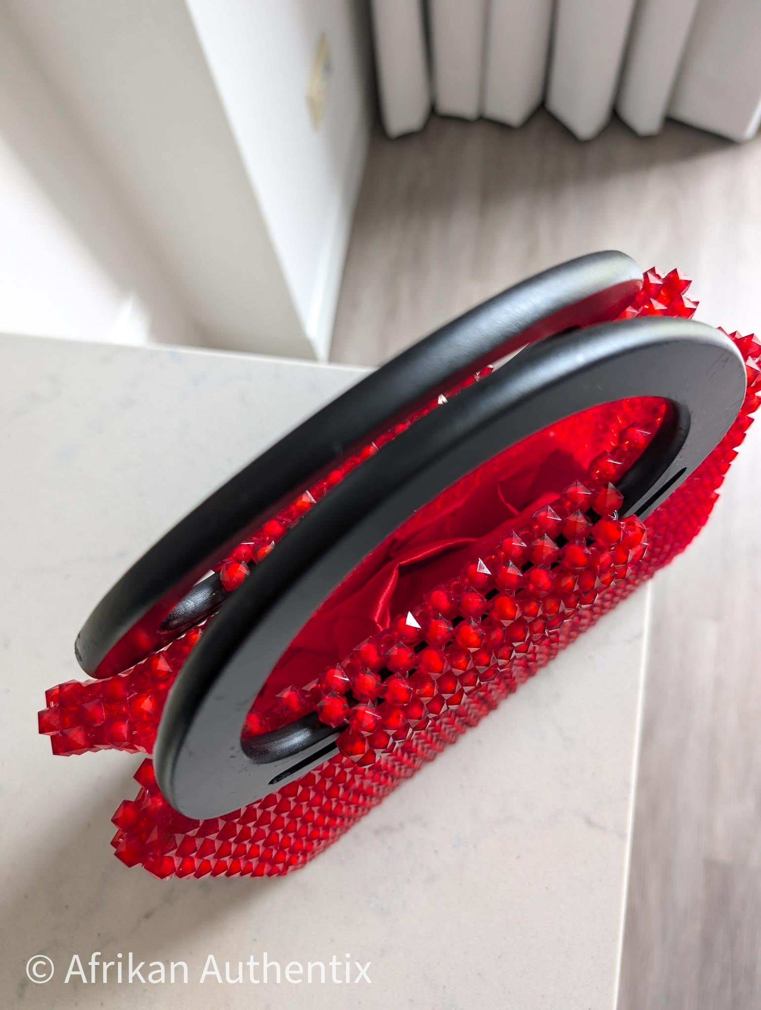 Red beaded square handbag with black wooden handle handmade in Ghana by Afrikan Authentix