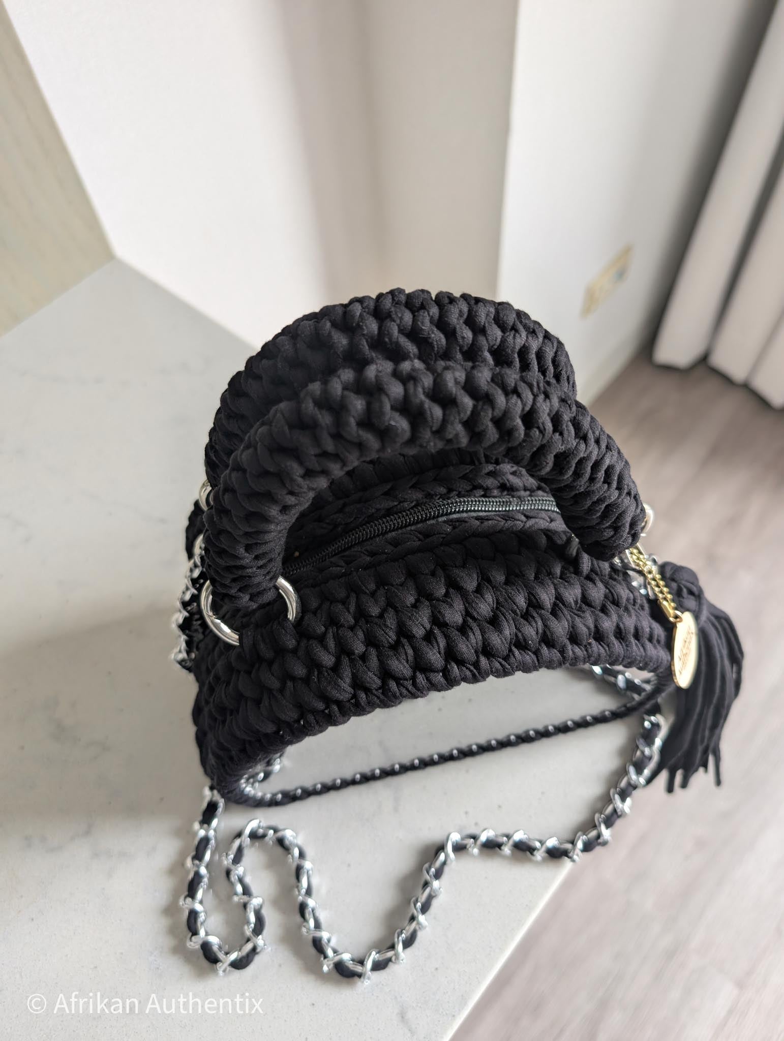 Black crochet handbag with silver chain strap and tassel by Afrikan authentix