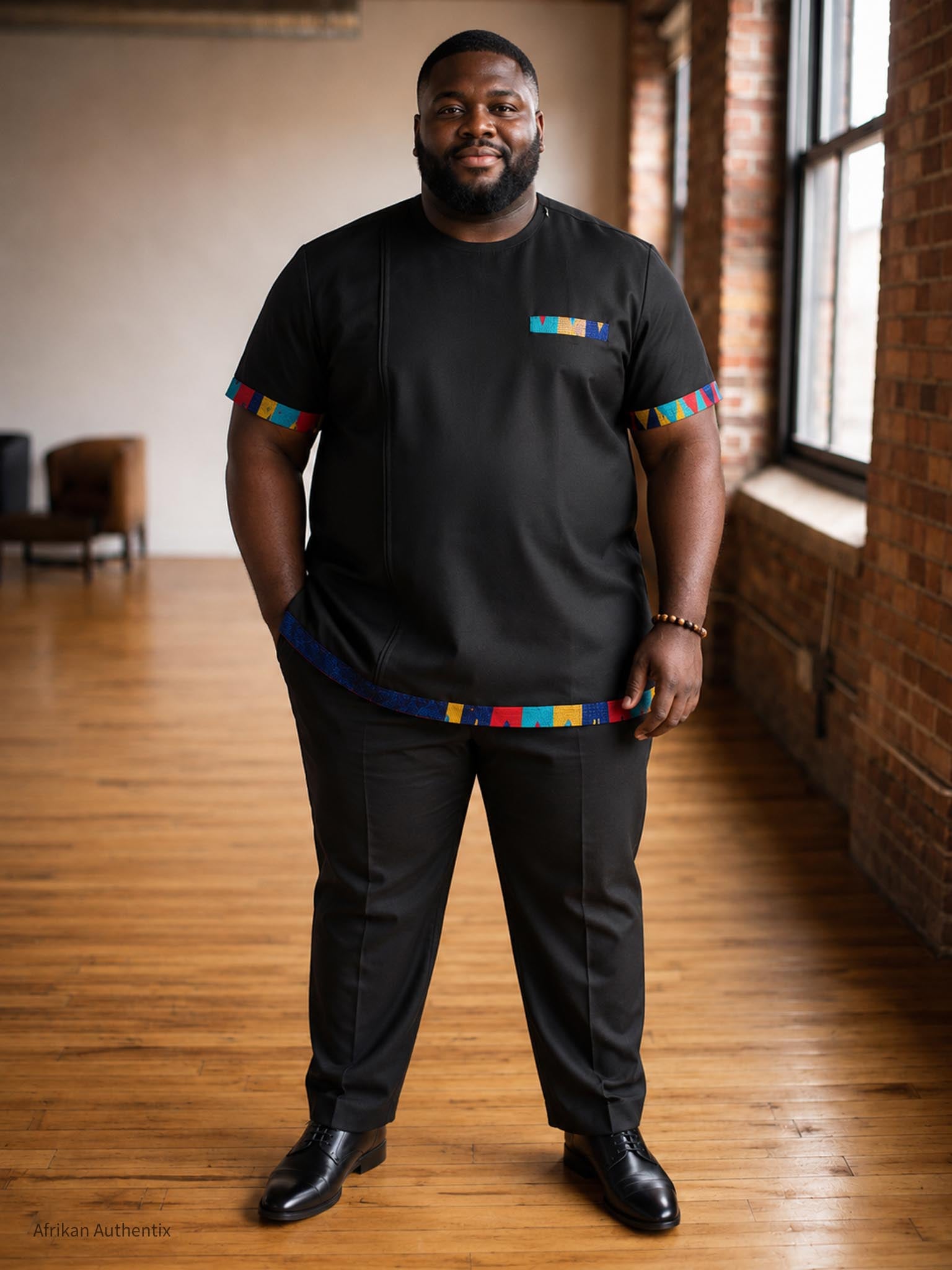 African men’s shirt styled with black dress pants and dress shoes