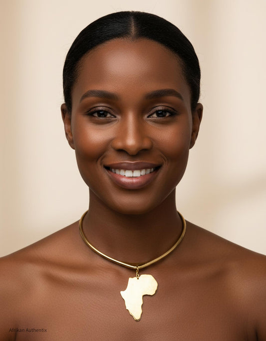 Woman wearing a gold necklace with an Africa map pendant against a beige background