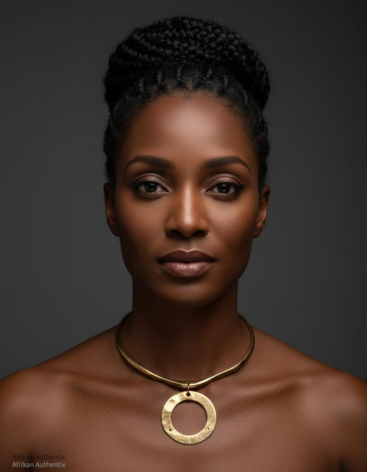 Woman wearing a brass collar necklace against a dark background
