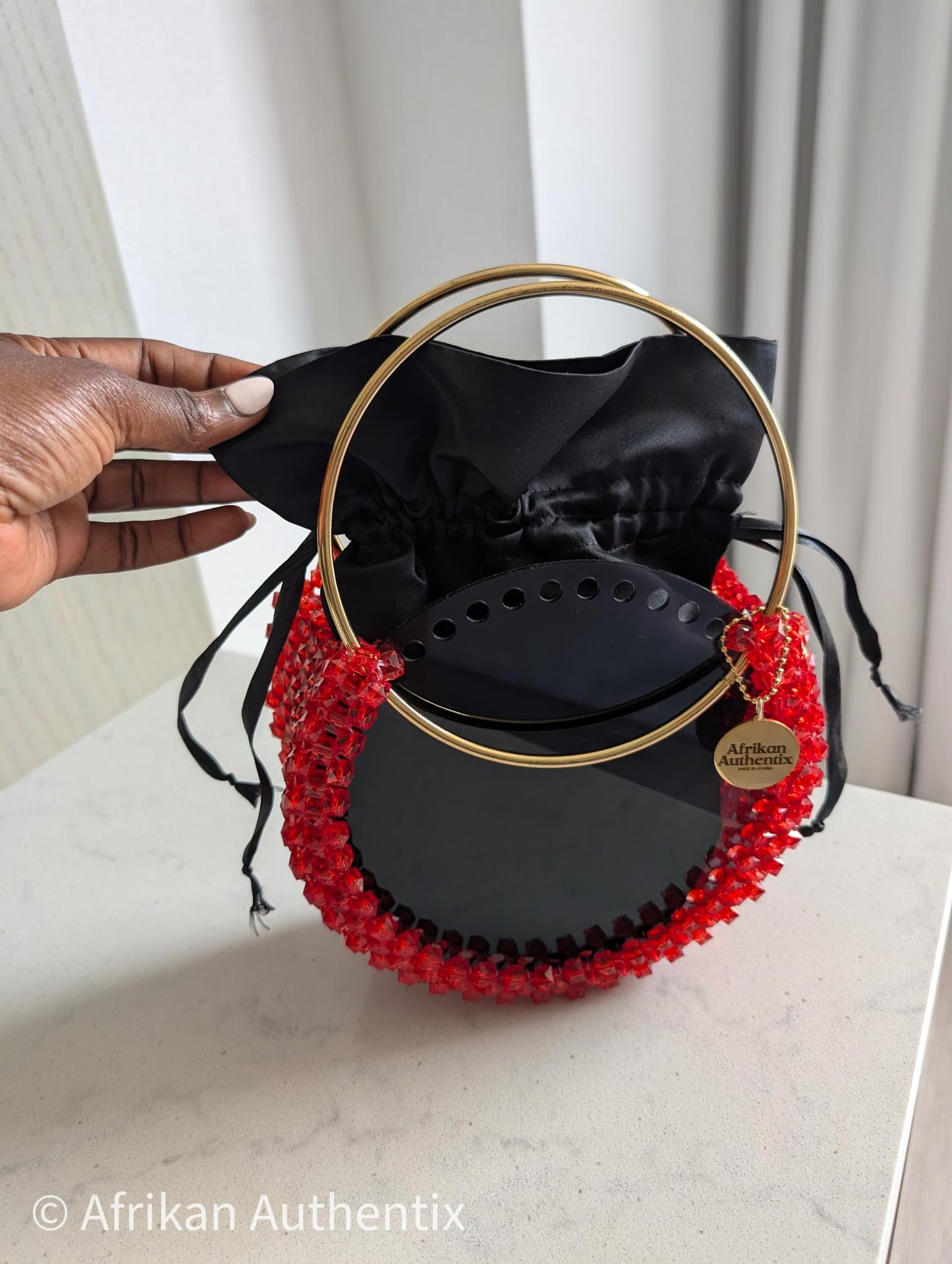 Red beaded handbag with golden handle from Ghana by Afrikan Authentix